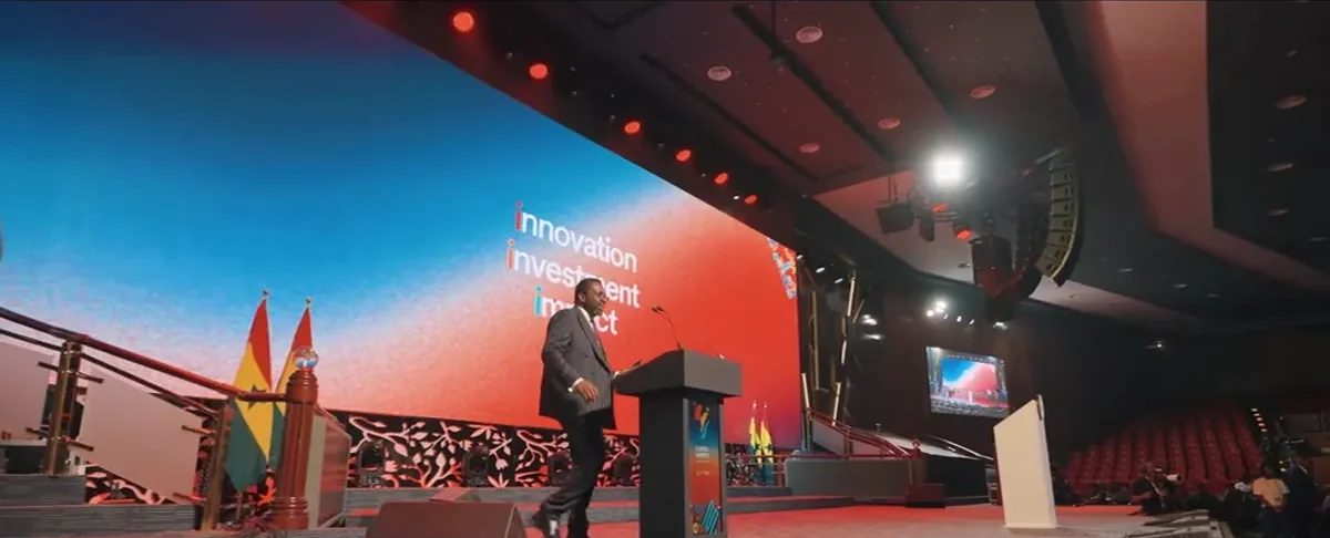 A professional conference stage covered by Olympus Atelier